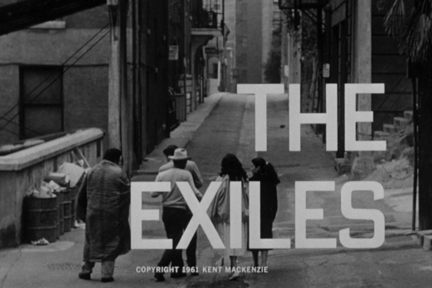 black and white film still with four people in a street with the film title overlaid